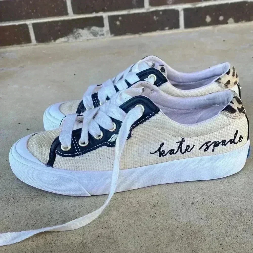 Keds beige canvas sneakers with black trim and leopard heel